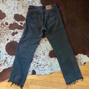 sick faded black vintage levi 501s with raw edge